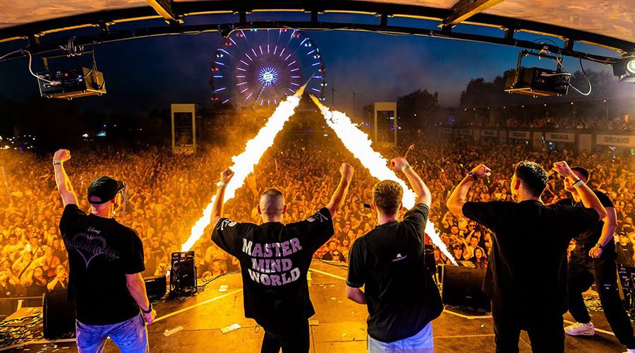 Topmodelz & Da Tweekaz live on stage with flame jets in front of a festival crowd