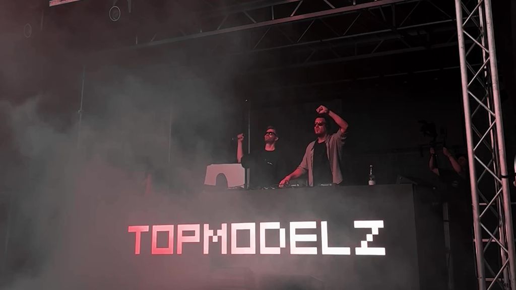 Michael Avenue and Marvin Mash of Topmodelz on stage behind the Topmodelz DJ booth